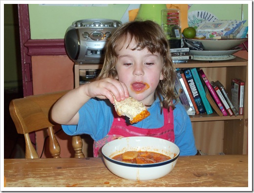 Rosemary, dipping her bread in the stew