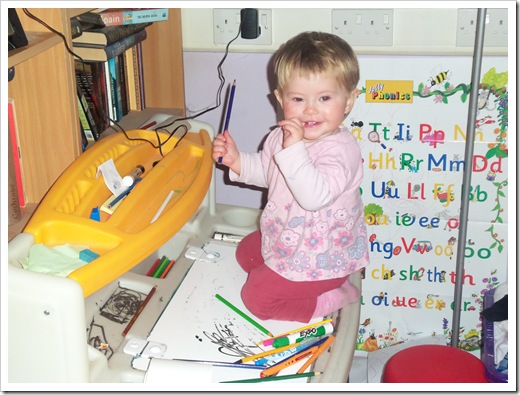 Eleanor on top of Rosemary's desk