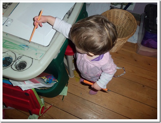 Eleanor holding a pencil