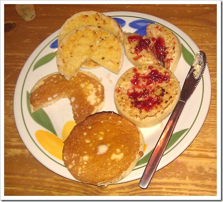A plate of crumpets (with raspberry jam), Scotch pancakes and English muffins