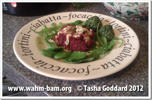 Vegetarian Seasonal Easter Starter: Beetroot roulade with a creamy courgette filling, served with a rocket and watercress garnish and spring green and mint pesto balls