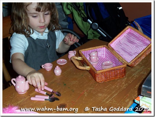 Playing with tea sets (www.wahm-bam.org © Tasha Goddard 2012)