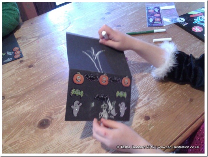 Making Halloween cards with stickers sent by Warner Bros.