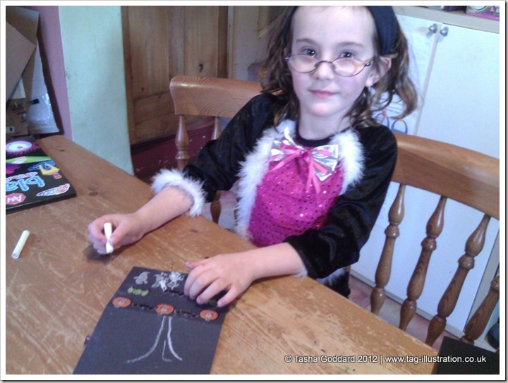Making Halloween cards with stickers sent by Warner Bros.
