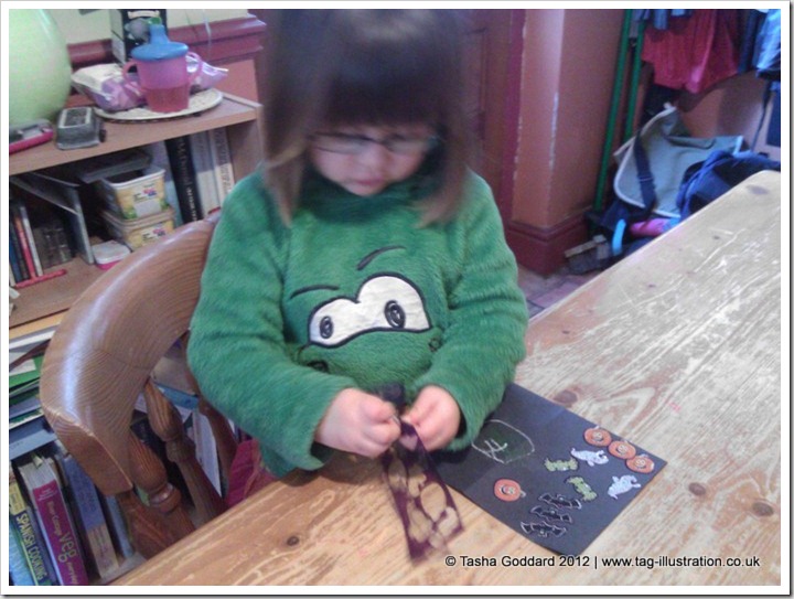 Making Halloween cards with stickers sent by Warner Bros.