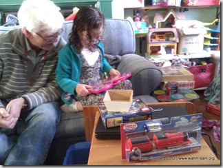Opening presents on Christmas No. 1   © Tasha Goddard   www.wahm-bam.org